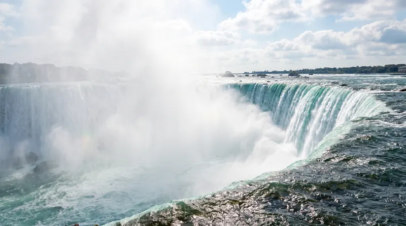 Niagara Falls powerful water flow and mist