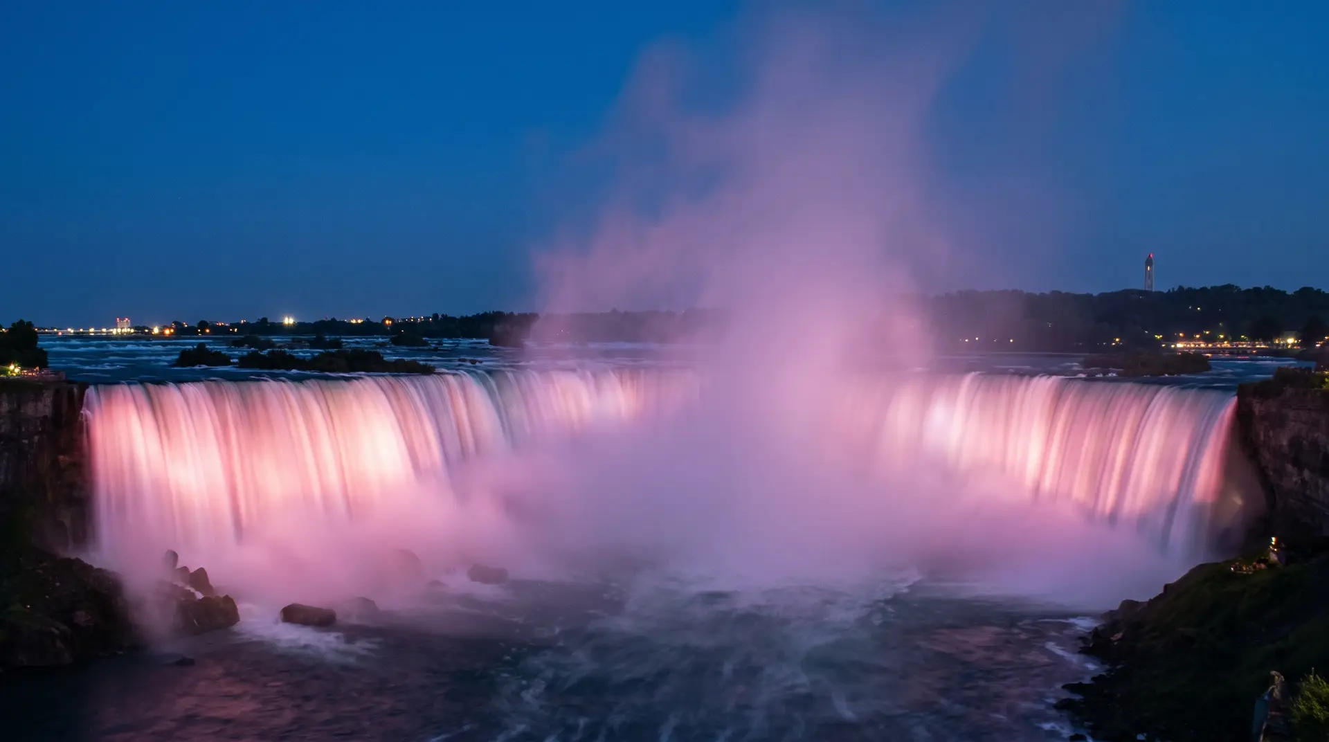 Niagara Falls illuminated in colour at night, private tour